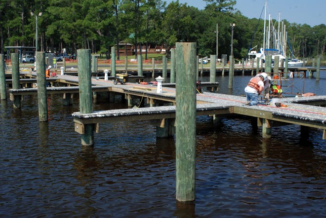 Workers put some finishing touches to new docks at the Hancock Creek Marina at Cherry Point.