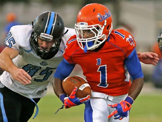 Bartow running back Dwayne Daughtry tries to elude Lake Region defender Matthew Stallings on Friday during Bartow's 44-14 victory at Bartow High School.