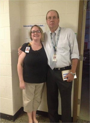 Steve Hudgins teaches in the social studies department at Ashbrook High School with his daughter, Kristen Childers.