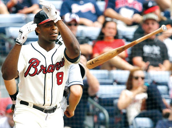 Atlanta’s Justin Upton throws his bat after striking out in Sunday’s game against the San Diego Padres.
(Butch Dill | Associated Press)