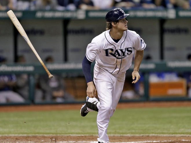 Tampa Bay's Wil Myers flips his bat as he watches his fifth-inning two-run double Monday during the Rays' 6-2 victory over the Texas Rangers in St. Petersburg.
(AP PHOTO)