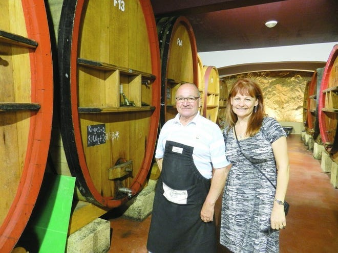 Melissa Radley-McConnell poses with a worker at Domaine de Frégate in Bandol, France. She travels all over the world to learn about wine to better serve her clients.