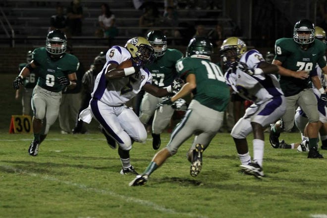 ACHS junior wing back Patrick Butler, Jr. eludes a defender in the game against Catholic of Pointe Coupee two weeks ago.