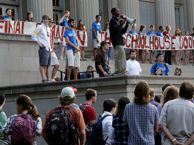 Univ. of Alabama student Isaac Bell of Montgomery, Ala., speaks to other students who gathered for a march on the Rose Administration Building to protest the university's segregated sorority system on the campus in Tuscaloosa, Ala., Wednesday, Sept. 18, 2013. About 400 students and faculty marched across the campus to oppose racial segregation among its Greek-letter social organizations.
