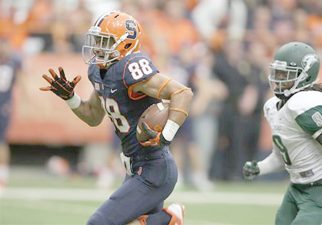 Syracuse's Jarrod West (88) runs ahead of Wagner's Deangelo James for a touchdown in the third quarter of Saturday's game in the Carrier Dome.



AP Photo/Nick Lisi