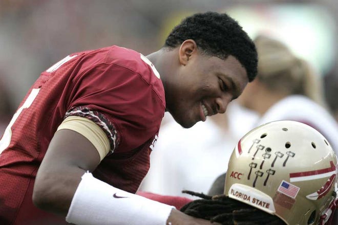 Steve Cannon Associated Press Florida State quarterback Jameis Winston talks to a teammate after being removed from the 62-7 rout of Nevada Saturday in Tallahassee.