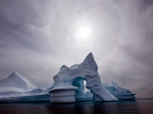 In this July 19, 2007, file photo, an iceberg melts off Ammassalik Island in Eastern Greenland. Scientists who are fine-tuning a landmark U.N. report on climate change are struggling to explain why global warming appears to have slowed down in the past 15 years even as greenhouse gas emissions keep rising. Leaked documents show there is widespread disagreement among governments over how to address the contentious issue in Sept. 23-26 stock-taking report by the Intergovernmental Panel on Climate Change. (AP Photo/John McConnico, File)