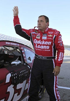 Ryan Newman waves to fans after qualifying for Sunday's NASCAR Sprint Cup auto race at New Hampshire Motor Speedway, Friday, Sept. 20, 2013, in Loudon, N.H. Newman won the pole. (AP Photo/Mary Schwalm)