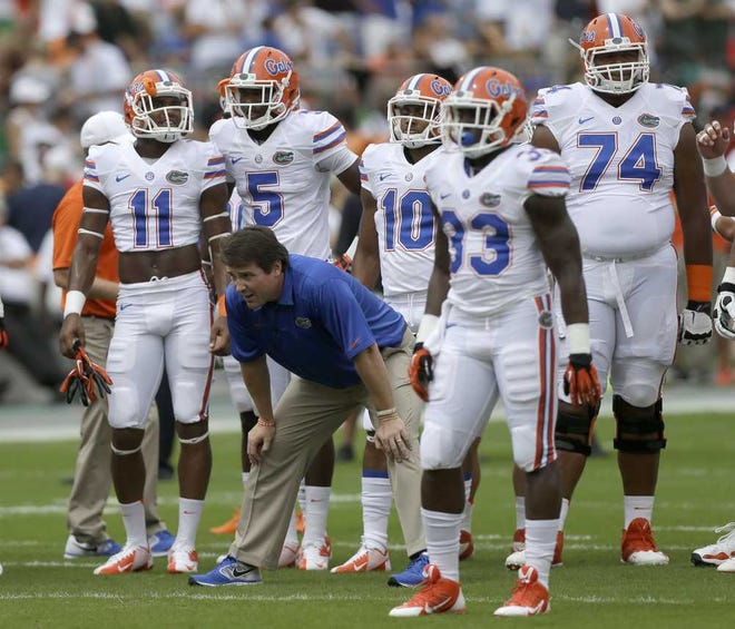 Florida head coach Will Muschamp watches during pre game practice before an NCAA football game against miami, Saturday, Sept. 7, 2013, in Miami Gardens, Fla. (AP Photo/Alan Diaz)