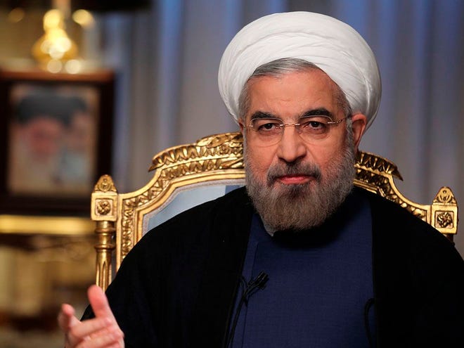 Iranian President Hasan Rouhani and President Obama may meet briefly next week for the first time, marking a symbolic but significant step toward easing their countries' tense relationship. (AP Photo/Presidency Office, Rouzbeh Jadidoleslam)