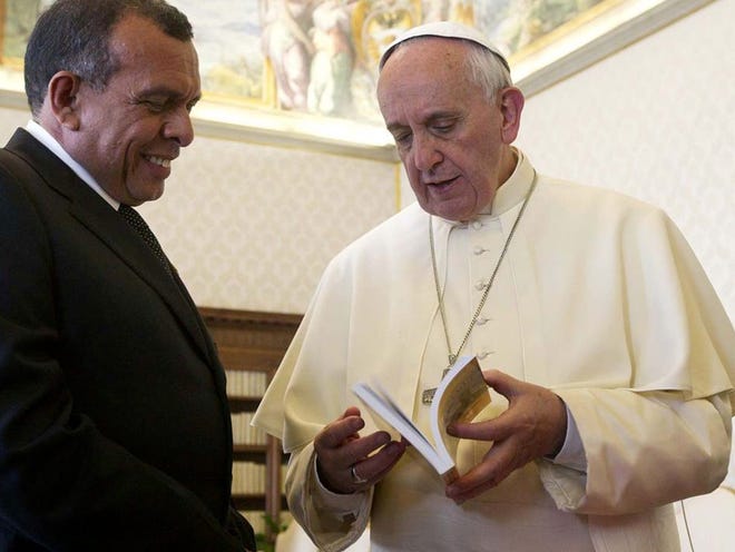 Pope Francis talks with Honduran President Porfirio Lobo Sosa during a private audience at the Vatican on Friday. The pope Friday encouraged Catholic doctors not to perform abortions a day after he criticized the church's "small-minded rules" that he said are driving the faithful away. 
(Claudio Peri | THE ASSOCIATED PRESS)