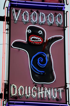In Portland, Ore., people try to beat the clock at VooDoo Doughnut.