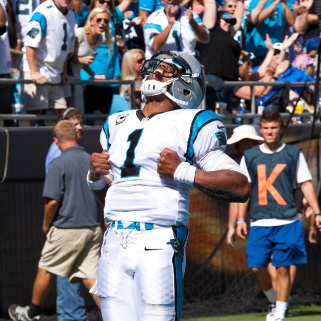 The Panthers' Cam Newton celebrates a touchdown Sunday in a 38-0 win against the New York Giants.