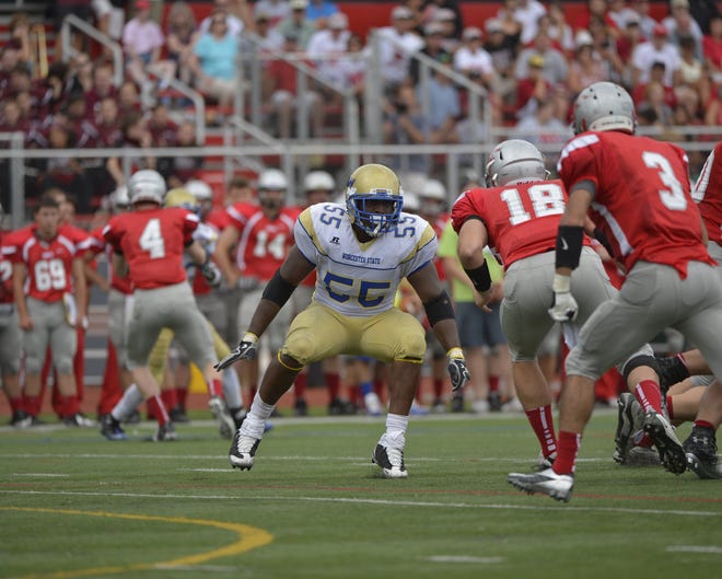 Medway native Bryan Narcisse (55) looks to make a play from his spot at defensive end for Worcester State. Photo Courtesy of Richard Orr Sports Photography
