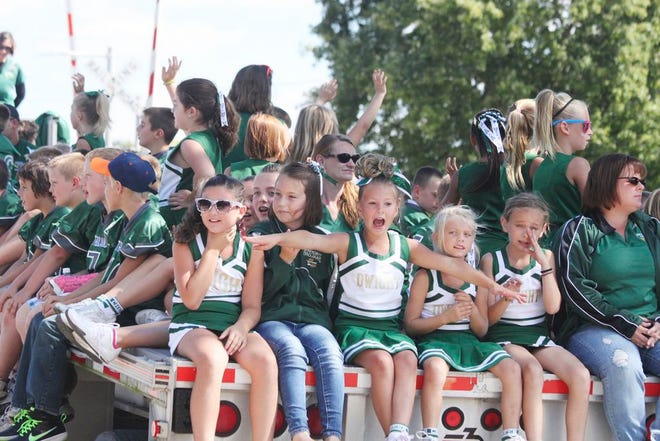 There was lots to cheer about during the Dwight Harvest Days Parade Sunday, like a great turnout, beautiful weather and 19 marching bands performing along the parade route. These girls are cheerleaders riding on a flatbed with the youth CIFL players.