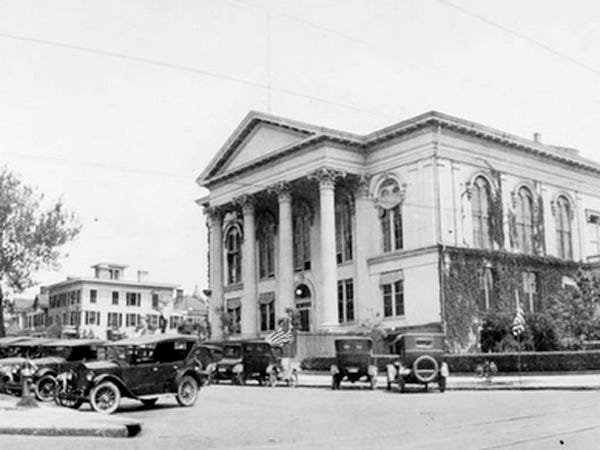 Thalian Hall. Note early automobiles parked diagonally on Third Street. Courtesy of the New Hanover County Public Library