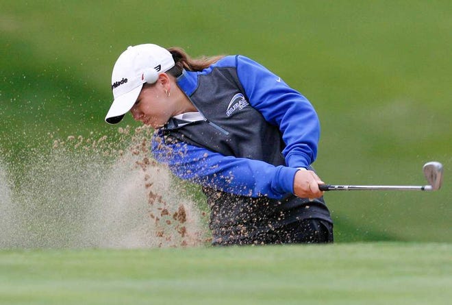Washburn Rural's Haley Flory lefts her ball out of the bunker during Tuesday afternoon's match at Topeka Country Club.