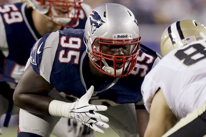 FILE - In this Aug. 9, 2012, file photo, New England Patriots defensive end Chandler Jones (95) lines up against New Orleans Saints tight end David Thomas (85) during an NFL preseason football game in Foxborough, Mass.