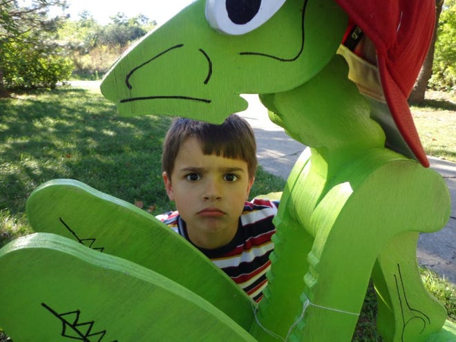 Amy Hoffman-Orman's grandsons have spent the summer getting to know the giant praying mantis down the road.
