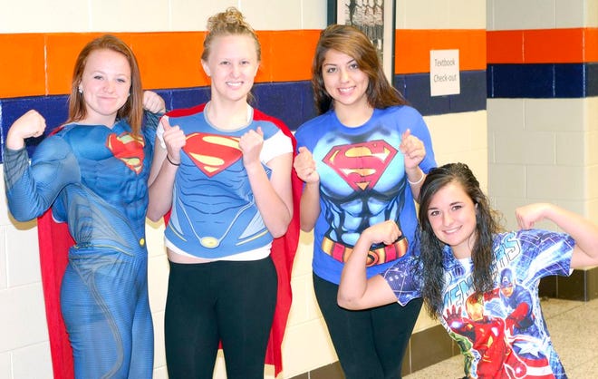 For the second day of spirit week at Pontiac Township High School students were asked to dress up as their favorite superhero. Showing off their Superman poses from left are Miranda Fitzsimmons, Olivia Bammann, Brianna Salinas and Katie Kuska.