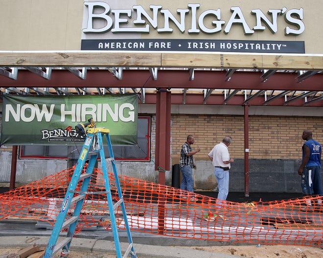 Work continues at the new Bennigan's restaurant at the Panama City Mall on Monday.
