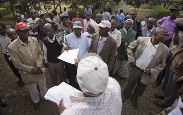 Relatives of some victims of the Westgate Mall attack wait for the death certificates in Nairobi, Kenya.