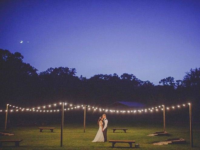 Dustin Prickett coincidentally captured the crescent moon, left, and the planet Venus, when he was shooting the wedding of Karly Kryza and Lucas Farmer. He's been getting media attention for it. (Photo provided by Dustin Prickett)