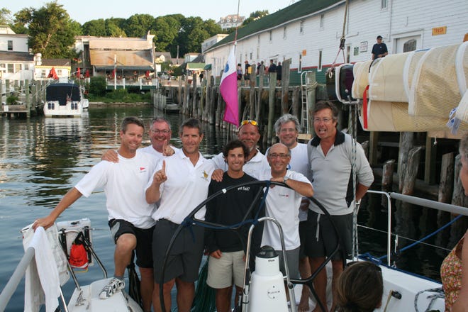 Members of the boat Sufficient Reason won their section in the Chicago to Mackinac race. From left, Grant Cheney, Troy Scharlow, Eric Ash, Louis Padnos, David Sligh, Mitch Padnos, Gregg Tabb and Tracy Brand.