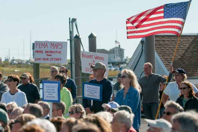 Marshfield and Scituate residents listen to speakers at the Stop FEMA Now rally on Saturday, Sept. 28, 2013 at the Mill Wharf restaurant in Scituate.