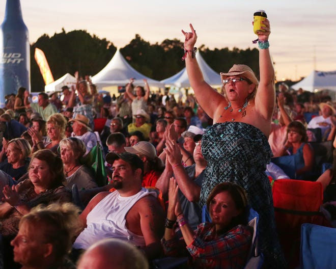 A fan cheers for Darryl Worley during the Gulf Coast Jam at Frank Brown Park in Panama City Beach on Saturday.
