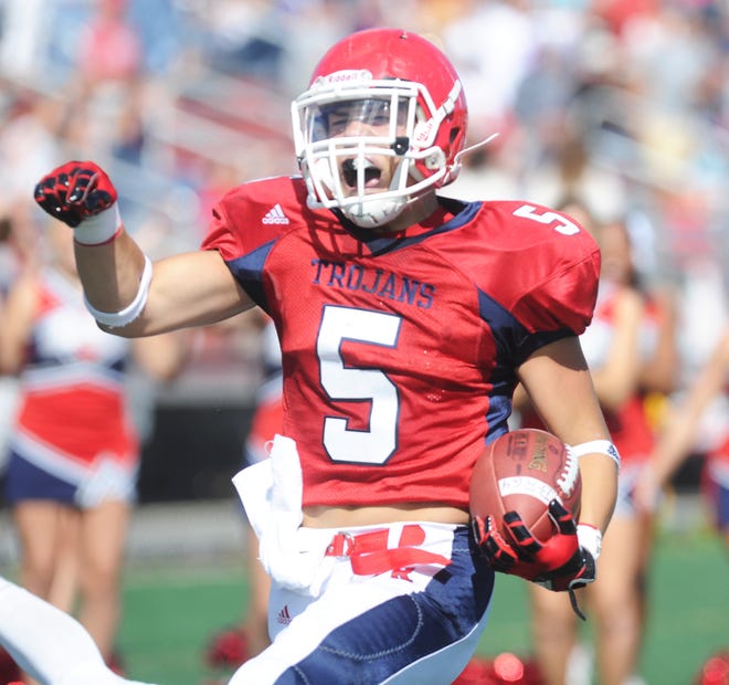 Bridgewater-Raynham's Brandon Gallagher celebrates a second-quarter touchdown against New Bedford during the game on Saturday, Sept. 28, 2013.
