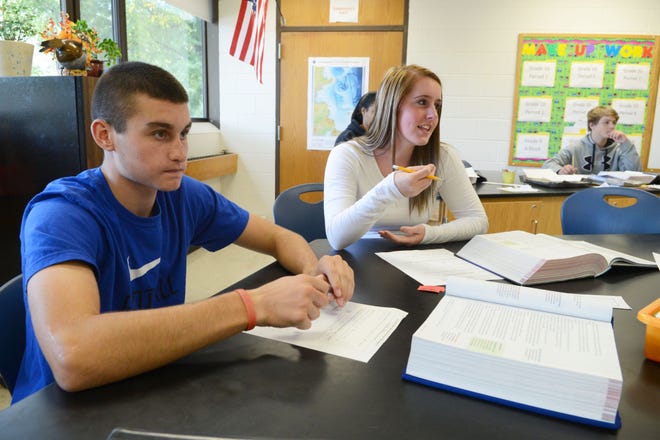Chad McGrath, 15, of Middleboro and Ericka Green, 16, of Taunton participate in English class with their teacher, Tasha Cordero, at Bristol-Plymouth Regional Technical School in Taunton.