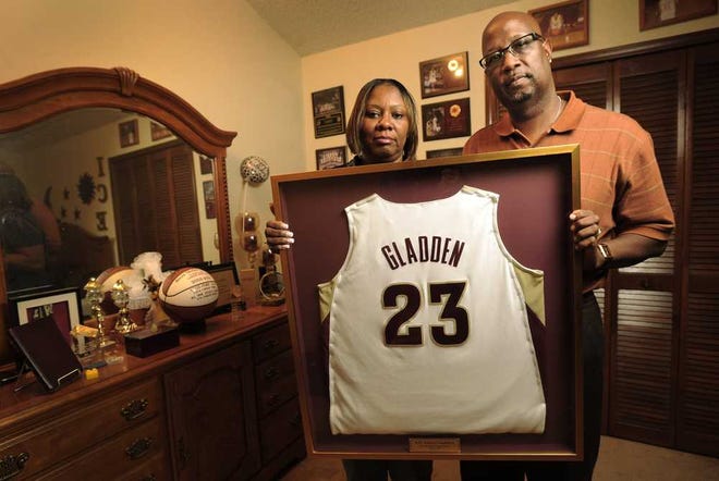 Bob.Self@jacksonville.com Frances and David Gladden, the parents of Orange Park High School and Florida State girls basketball player Alicia Gladden, hold their daughter's FSU jersey in her bedroom at their Orange Park home. Alicia was killed in a car crash which was caused by a drunken driver who was also killed in the crash..