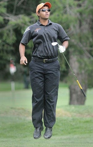 Pennsbury High School's Vinay Ramesh jumps up to see where his ball landed during a golf match Friday against Central Bucks High School West.