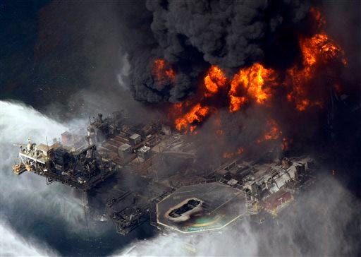 In an April 21, 2010 file photo, the Deepwater Horizon oil rig burns after a deadly explosion in the Gulf of Mexico. Anthony Badalamenti, who was the cementing technology director for Halliburton Energy Services Inc., was charged Thursday with destroying evidence following BP’s 2010 oil spill in the Gulf of Mexico.