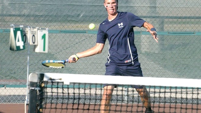 Hendrickson’s Kyle Marse returns serve during the first matchup of the District 16-5A Team Tennis Tournament on Monday. Hendrickson faced Stony Point at home. Joe Harrington/ PFLUGERVILLE PFLAG