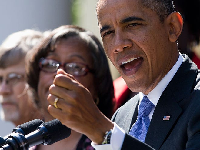 President Barack Obama gestures while speaking in the Rose Garden of the White House in Washington, Tuesday, Oct. 1, 2013, about the government shutdown. Congress plunged the nation into a partial government shutdown Tuesday as a protracted dispute over Obama's signature health care law reached a boiling point, forcing some 800,000 federal workers off the job.