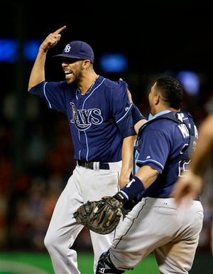 Tampa Bay Rays' David Price and Jose Molina (28) celebrate after defeating Texas Rangers 5-2 in their American League wild-card tiebreaker baseball game Monday, Sept. 30, 2013, in Arlington, Texas.