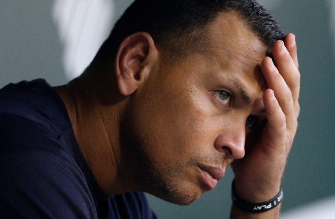 New York Yankees' Alex Rodriguez wipes sweat from his brow as he sits in the dugout before a baseball game against the Baltimore Orioles, Wednesday, Sept. 11, 2013, in Baltimore.