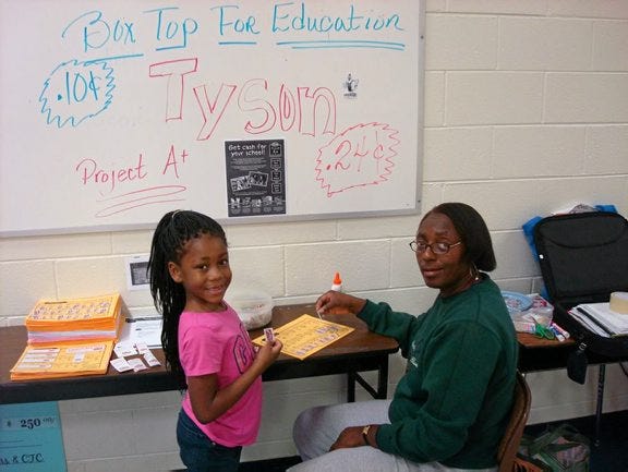 CONTRIBUTED PHOTO
An Ettrick Elementary School student is shown with Brenda Branch, Tyson Project A+ program coordinator. The school is participating in the program to raise extra funds for school needs, including supplies, equipment, building repairs and school programs.