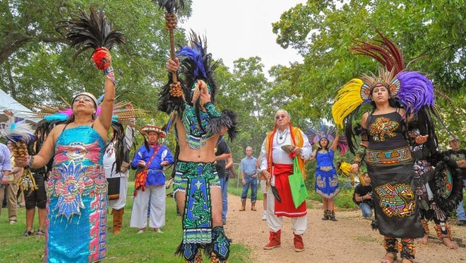 A traditional blessing during last year’s powwow at the springs in San Marcos, including dancers from Cuicani In Xochitl of Dallas. From left are Esperanza Perez Perez, David Alonzo, Dr. Mario Garza, Cristina Salazar and Anabel Salazar. Photo Courtesy of Rene Renteria.