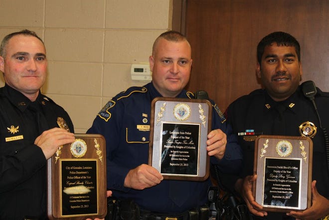 Corporal Randy Clouatre, Jr. of the Gonzales Police Department; Senior Trooper Tim Moise of the La. State Police; and, Deputy Larry Gunnes of the Sheriff’s Office, receive honors at St. Theresa of Avila Knights of Columbus Council 2657’s 38th Annual Law Enforcement Banquet, Sept. 25, in Gonzales.