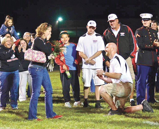 Kurt Twichell asks his girlfriend Kate Gilbert to marry him after the White Pigeon homecoming game Friday.