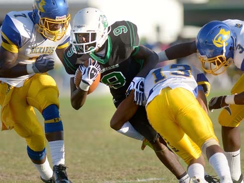 Choctawhatchee's Richie Grant is tackled by the Rickard's defense on Friday.