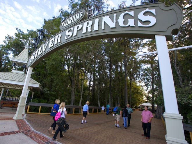FILE - Visitors enter Silver Springs attraction that opened as a Florida State Park in Silver Springs on Tuesday.