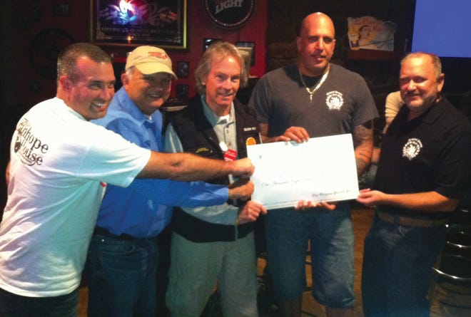 The Original Pocono Pub in Bartonsville presents a $1,814 check to the Monroe County chapter of Operation Chillout. From left are Tom Wicklow, Tony DeStefano and Ray Chimileski of Operation Chillout and pub manager Stephen Bongiovanni and owner Rick DeFino at the pub.