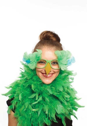 This photo provided by courtesy of the Martha Stewart Halloween special issue shows a parrot costume, worn with a feathery boa and colored feathers and a yellow paper beak attached to cheap, plastic glasses. See the special issue "Martha Stewart Halloween" for more details. With supplies on hand and minor purchases, a Halloween costume can be assembled in a snap. (AP Photo/Copyright 2013 Martha Stewart Halloween Special Issue, Bryan Gardner) **MANDATORY CREDIT**