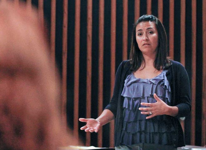 Teresa Ramirez, the case manager for the YWCA, talks about domestic violence among immigrants during a luncheon Thursday at the Shawnee County Health Agency.