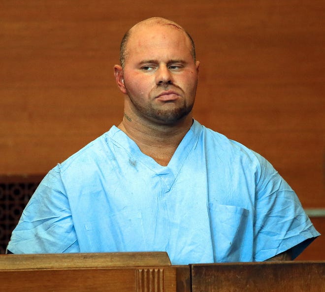 Jared Remy appears at Waltham District Court for his arraignment, Friday in Waltham, Mass., on domestic assault and battery charges in connection with the death of 27-year-old Jennifer Martel.