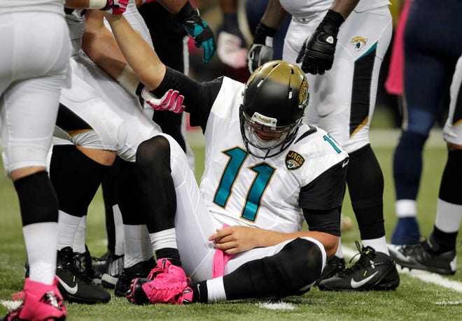 Jacksonville Jaguars quarterback Blaine Gabbert is slow to get up during the second quarter of an NFL football game against the St. Louis Rams Sunday, Oct. 6, 2013, in St. Louis. (AP Photo/Tom Gannam)